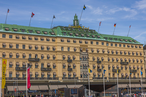 Stockholm. Sweden. Europe. 05.18.2022. Beautiful view of Grand Hotel facade on blue sky background.