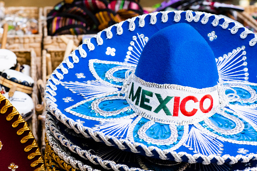 In Playa del Carmen, Mexico a sombrero on retail display outdoors along 5th Avenue has the word Mexico embroidered on the merchandise for sale.