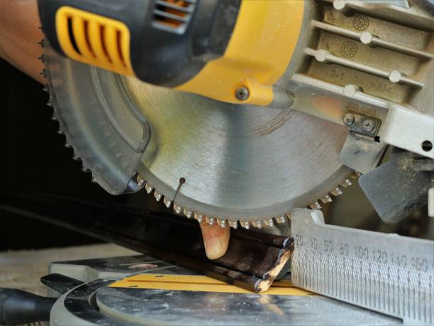 istock fitting a wood panel to a miter saw 1447479830