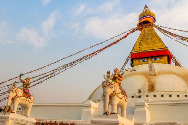 Bouddha Stupa at sunset in Kathmandu Boudhanath Stupa (also known as Bouddha Stupa or Khasti Chaitya) at sunset in Kathmandu city, Nepal. Prayer flags sways on the wind. No people. Religious architecture theme. stupa stock pictures, royalty-free photos & images