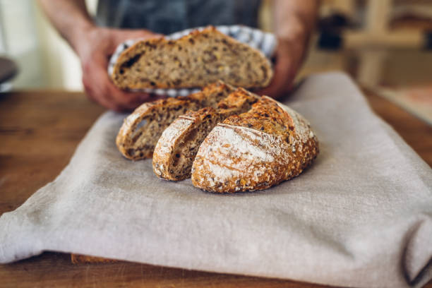 istock Woman holding a loaf of bread 1447481221