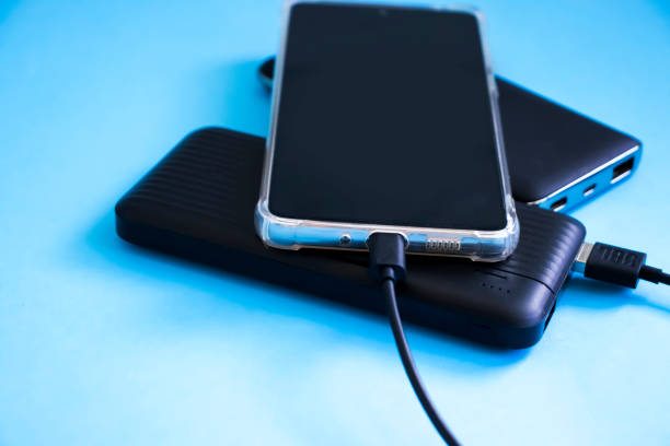 istock Smartphone and power bank on color background 1447482926