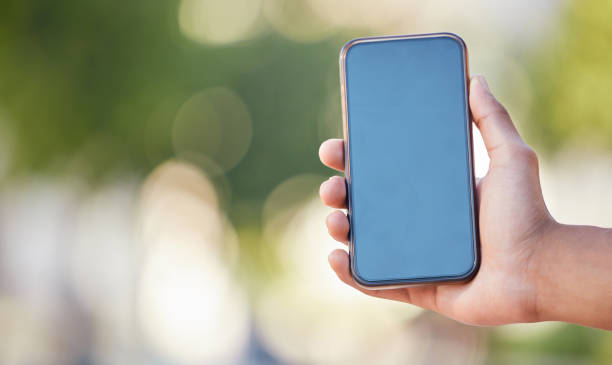 istock Phone green screen, hand or mobile mockup for networking, 5g network or social media app communication in park. Digital screen space, tech or smartphone for contact us, internet or website search 1447482994