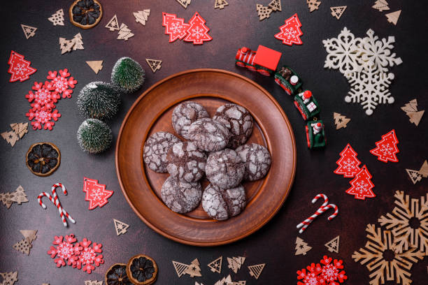 istock Delicious fresh brownies with Christmas decorations on a dark concrete background 1447484903