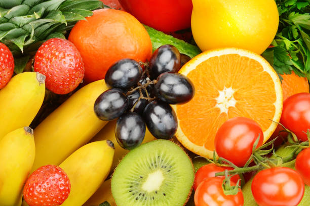istock Beautiful bright background from vegetables and fruits. 1447485473