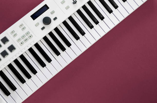 istock Music background with music keys on a magenta background, flat lay, copy space. 1447492106