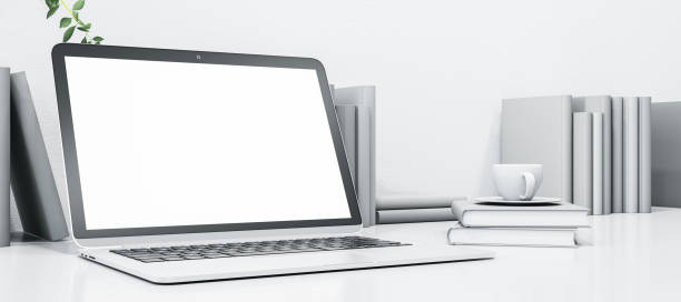 istock Clean white designer desktop with empty mock up computer monitor, coffee cup and books. 3D Rendering. 1447497175