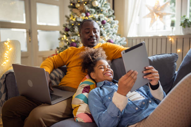 istock Father and daughter spending Christmas together 1447498378