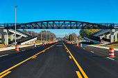 Freshly Paved Road Under New Pedestrian Bridge