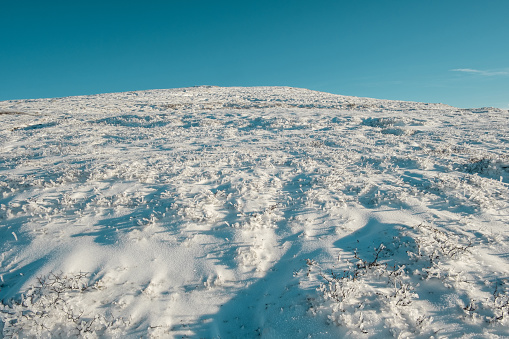 beautiful winter landscape snow mountain Litjskarven in Norway in sunnlight