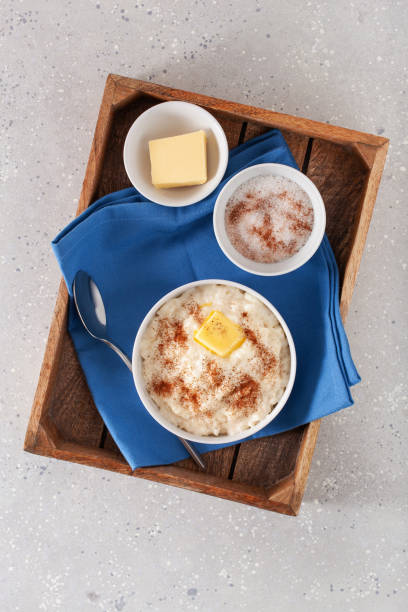 istock rice pudding with butter cinnamon. french riz au lait, norwegian risgrot, traditional breakfast dessert 1447500449