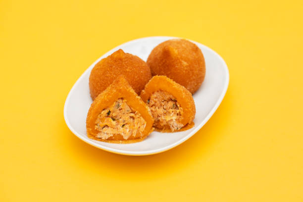 istock traditional brazilian fried drumsticks Coxinha de frango on a small dish 1447502227