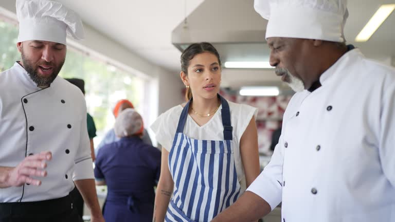 Colleagues arguing about a dish in the kitchen