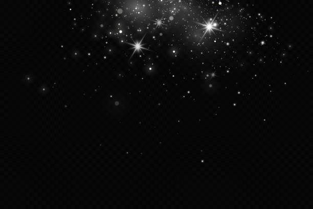 istock Particles of white magic dust. Shining light particles.Christmas glitter particles. Light effect on a transparent background 1447505454