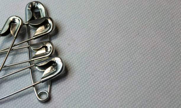 istock Pins close-up on a white background. 1447505601