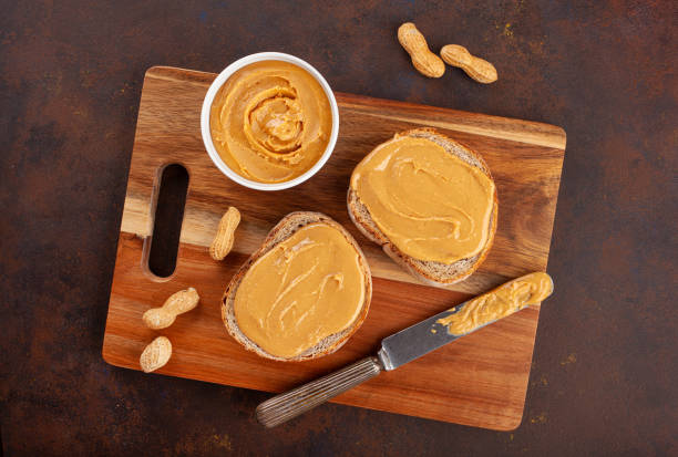 istock smooth peanut butter bread toast, healthy traditional sandwich 1447506825