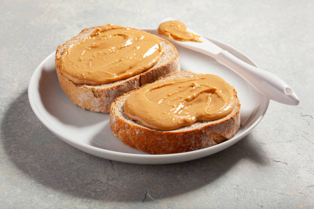 istock smooth peanut butter bread toast, healthy traditional sandwich 1447506869