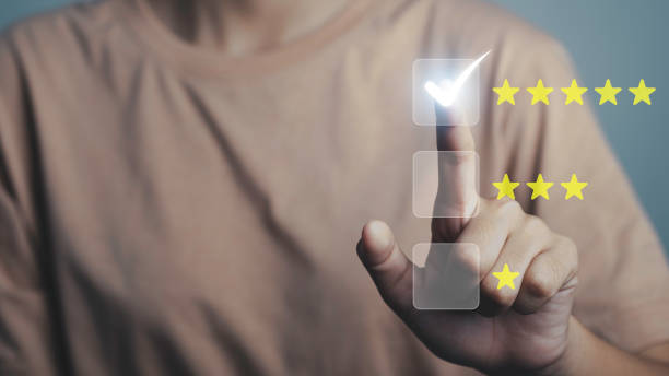 istock Customer give rating to service experience on satisfaction. Used feedback survey quality rate is Good Service, Positive Rating, Happy Service, Five Star Service on virtual touch screen. 1447508509