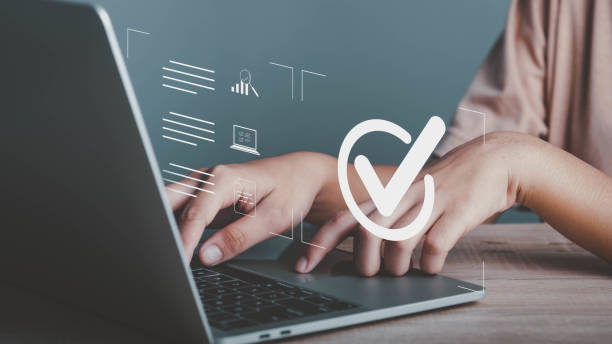 istock Quality assurance, Guarantee, ISO certification and standardization concept. Businessman working on laptop with check mark sign. Compliance to regulations and standards, International information security standard. 1447508689