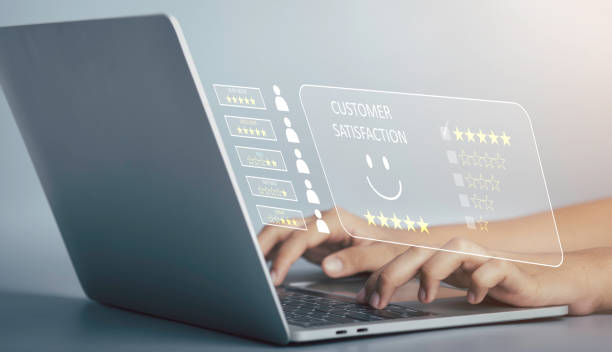 istock Customer Experience feedback concept. Businessman give five stars with smiley face for the best excellent evaluation of satisfaction; service like; Good quality; High rating; very good by laptop. 1447508701