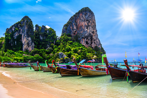 Long tail boats and rocks on Railay beach west, Ao Nang, Krabi, Thailand