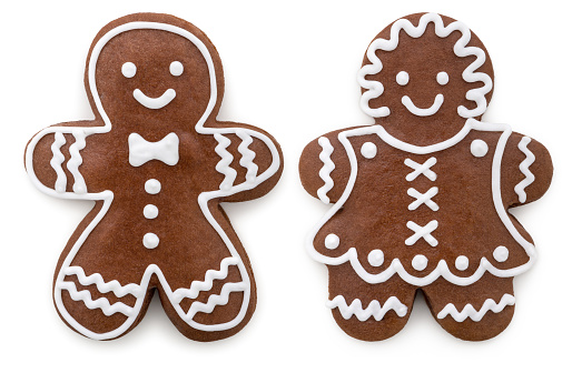 Gingerbread cookies for Christmas. \nMan and woman. \nIsolated on white.