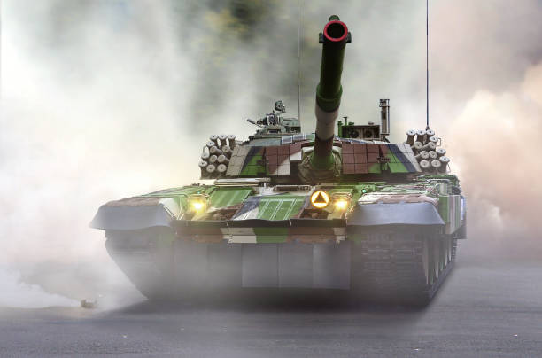 istock Army battle tank at war under smokey ground 1447518075