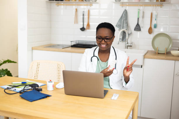 istock Female doctor talking with colleagues through a video call 1447520840