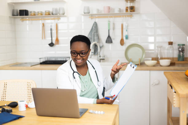 istock Female doctor talking with colleagues through a video call 1447520879