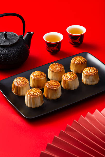 istock Chinese moon cakes on a black plate on a red background 1447523376