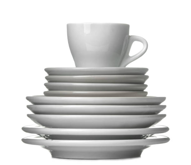 istock A stack of dishes. Dinnerware. plates and cup on a white isolated background. close-up. 1447524805
