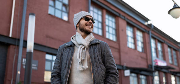 istock successful young man with a big smile on his face outside 1447525168