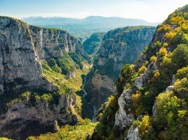 Vikos Gorge, a gorge in the Pindus Mountains of northern Greece, lying on the southern slopes of Mount Tymfi, one of the deepest gorges in the world. Aerial view of Vikos Gorge, a gorge in the Pindus Mountains of northern Greece, lying on the southern slopes of Mount Tymfi, one of the deepest gorges in the world. Zagori region, Greece. zagori stock pictures, royalty-free photos & images