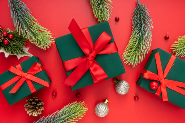 istock Christmas composition. Christmas gifts and decorations on red background. 1447532605