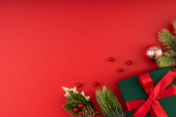 istock Christmas composition. Christmas gifts and decorations on red background. 1447532613