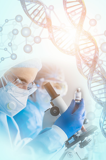 vaccine research and development background of research scientist holding vaccine bottle in hand in modern clinical laboratory with microscope overlay with DNA strand and molecules symbol in concept of vaccine research and development with light flare