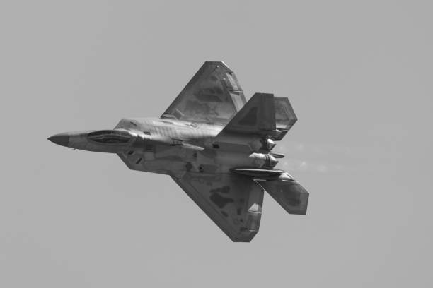 istock F-22 Raptor in a turn in beautiful light ,  with afterburners on 1447537880