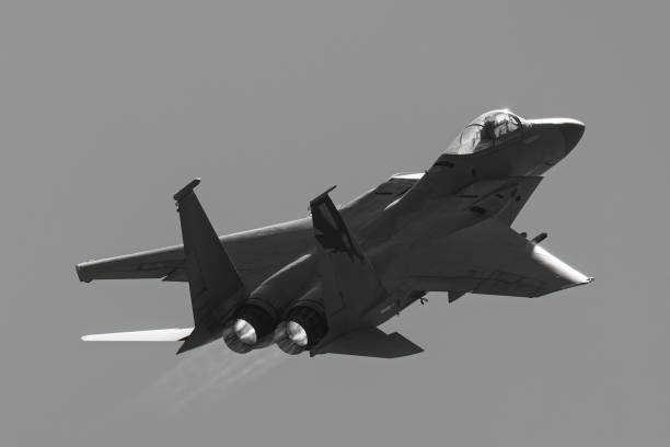 istock F-15 Eagle in beautiful light with afterburners 1447537972