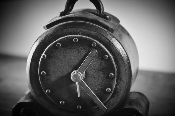 istock vintage leather clock in white and black on table 1447539763