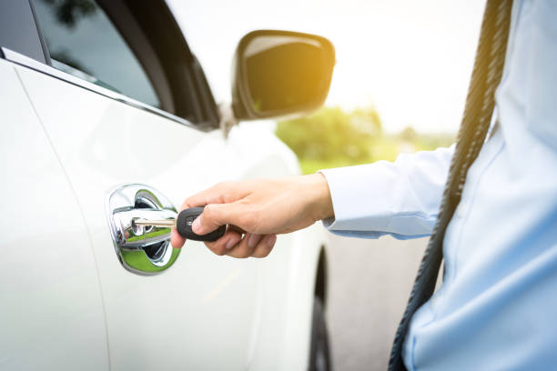 istock employee opening car door to go to work. 1447542830