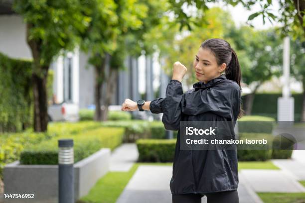Beautiful Asian Woman Wearing Sportswear Warming Up Before Running Confident And Powerful Woman Stretching Before Workout Exercise In The Morning Healthy And Active Lifestyle Concept Stock Photo - Download Image Now