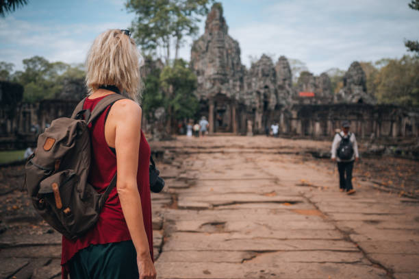 istock A woman exploring the temples at the Angkor Wat complex 1447548476