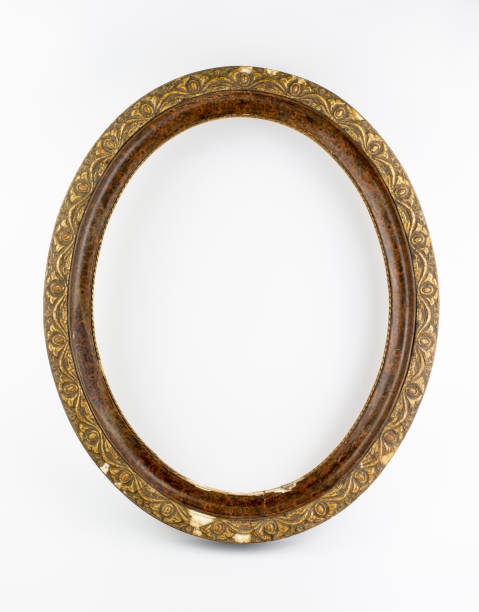 istock Old antique oval wooden picture frame isolated on white background. 1447549868