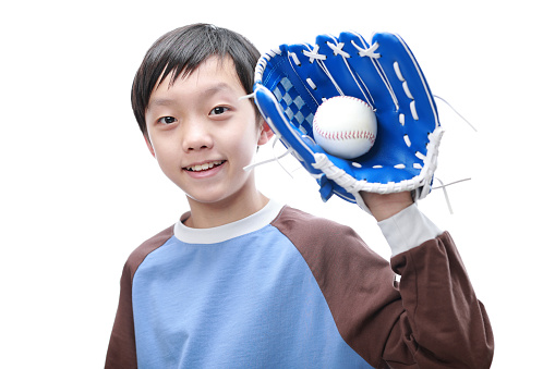 Boy wearing a baseball helmet and a glove