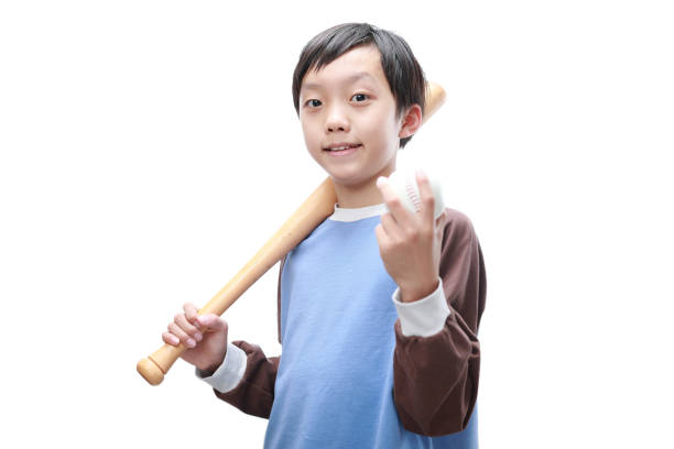 istock Joyful little boy posing with a baseball bat 1447551890
