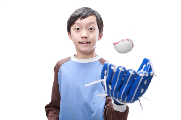 Boy wearing a baseball helmet and a glove