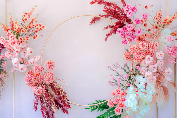 istock Colorful floral frame with space for text on light pink background. The backdrop for the wedding. Copy space. 1447552120