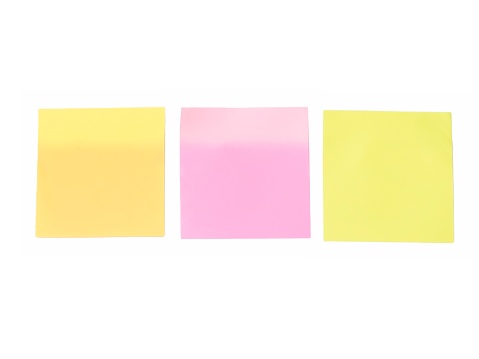 Collection of three colored sheet or sticky notes isolated on white background.