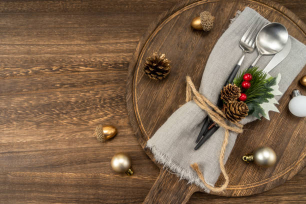 istock Festive dinner table setting spoon, fork knife, christmas decorations. Christmas concept. 1447554747