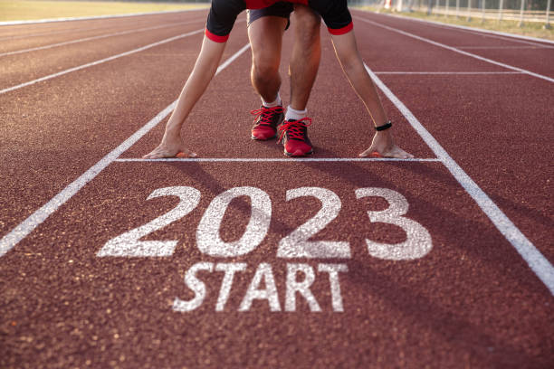 Young man ready to run preparing for 2023 goals. stock photo
